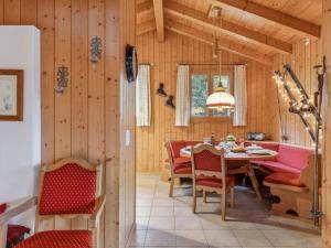 a dining room with a table and chairs at Apartment Roossihuus Apt-S by Interhome in Wengen +34 photos