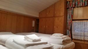 Posteľ alebo postele v izbe v ubytovaní Chalet Belvedere