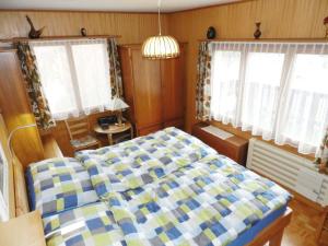 Postel nebo postele na pokoji v ubytování Apartment Fluehüsli by Interhome