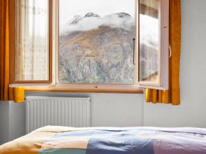 En eller flere senger på et rom på Apartment Heimine by Interhome