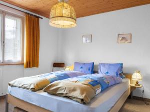 En eller flere senger på et rom på Apartment Heimine by Interhome