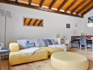a living room with a couch and a table at Apartment Castello by Interhome in Grächen +21 photos