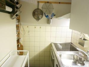 Kuchyň nebo kuchyňský kout v ubytování Apartment La Sarine 13 by Interhome