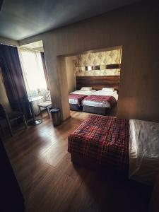 Postel nebo postele na pokoji v ubytování Hotel Altunhan
