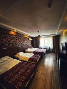 Postel nebo postele na pokoji v ubytování Hotel Altunhan