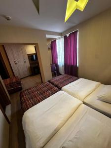 Postel nebo postele na pokoji v ubytování Hotel Altunhan