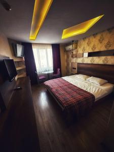 Postel nebo postele na pokoji v ubytování Hotel Altunhan