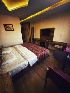 Postel nebo postele na pokoji v ubytování Hotel Altunhan