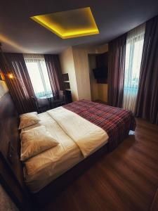 Postel nebo postele na pokoji v ubytování Hotel Altunhan