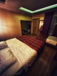 Postel nebo postele na pokoji v ubytování Hotel Altunhan