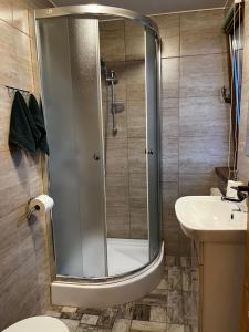 a bathroom with a shower and a toilet and a sink at ,, U Nikoli" in Bukowina Tatrzańska +22 photos