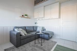 a living room with a couch and a table at Moonlight 214 in Levi