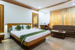 Postel nebo postele na pokoji v ubytování Garden Hotel