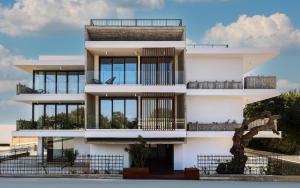 a building with balconies on the side of it at Avenue 101 2 BED in Paphos