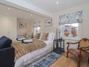 a bedroom with a large bed and a chair at Providence Court in York