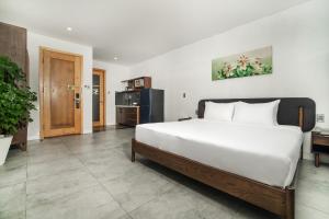 Kuchyň nebo kuchyňský kout v ubytování DOMA by HSuites Hotel & Apartment