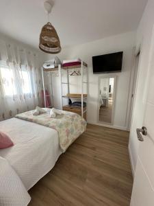 Posteľ alebo postele v izbe v ubytovaní Apartamento Entre dos mares