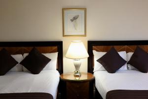 Postel nebo postele na pokoji v ubytování Britannia Hotel Aberdeen