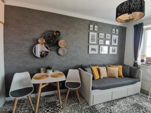 a living room with a couch and a table at PÁLFFY in Bratislava +1 photo