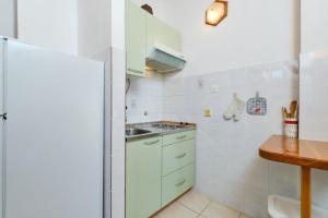 Kuchyň nebo kuchyňský kout v ubytování Apartment Luce