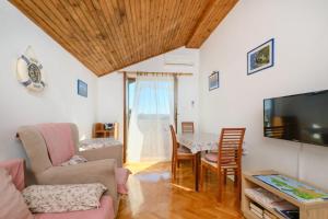 TV a/nebo společenská místnost v ubytování Apartment Luce
