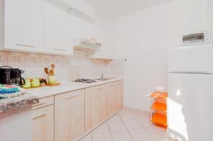 Kuchyň nebo kuchyňský kout v ubytování Apartment Luce