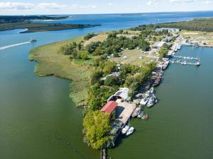 an island in a body of water with a marina at Halbinsel Resort Peenemünde in Peenemünde