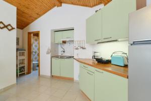 Kuchyň nebo kuchyňský kout v ubytování Apartment Luce