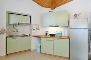 Kuchyň nebo kuchyňský kout v ubytování Apartment Luce