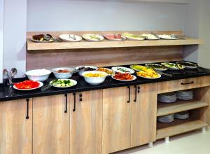 a buffet with many plates of food on it at Diamond Hotel in Istanbul