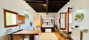 a room with a desk and a bed in a room at Villa Ses Casetes Ibiza in Montecristo