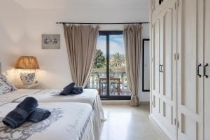 Ένα ή περισσότερα κρεβάτια σε δωμάτιο στο Bed & Breakfast La Vida en Rosa