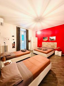 En eller flere senge i et værelse på B&B Cosmoneapolitan