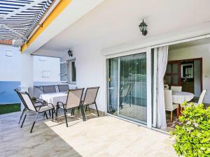 a dining room with a table and chairs at Holiday Home Karlo by Interhome in Posedarje