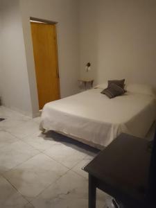 Postel nebo postele na pokoji v ubytování Nuestro Sueño