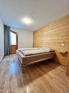 Postel nebo postele na pokoji v ubytování Appartamento Cima Cavalli