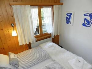 Giường trong phòng chung tại Apartment Halten by Interhome