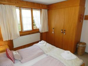 Giường trong phòng chung tại Apartment Halten by Interhome