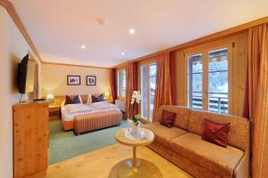 Rúm í herbergi á Hotel Kirchbühl Superior