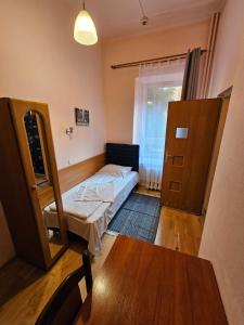 Łóżko lub łóżka w pokoju w obiekcie Hotel Haga