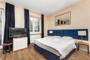 TV a/nebo společenská místnost v ubytování Apartamenty Piękna 28A by Your Freedom