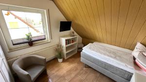 Postel nebo postele na pokoji v ubytování Gästezimmer zum Waldsachsener Grund