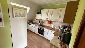 Kuchyň nebo kuchyňský kout v ubytování Gästezimmer zum Waldsachsener Grund