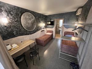 a living room with a couch and a table at Ночівля in Poltava