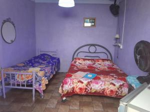 Ένα ή περισσότερα κρεβάτια σε δωμάτιο στο Hospedagem Chapéu Virado +23 φωτογραφίες