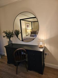 a room with a desk and a mirror at Newditch Farm - BRS Airport in Bristol +23 photos