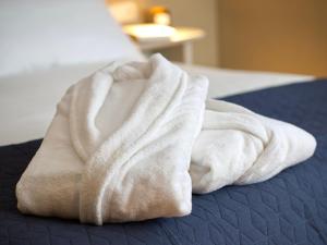 Cama o camas de una habitación en Hotel Ciudad del Sol