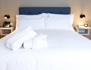 Cama o camas de una habitación en Hotel Ciudad del Sol