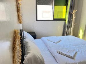 Letto o letti in una camera di Sun Set Surf House Imsouane