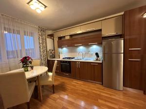 Kuchyň nebo kuchyňský kout v ubytování Apartament Sonia - 2 dormitoare